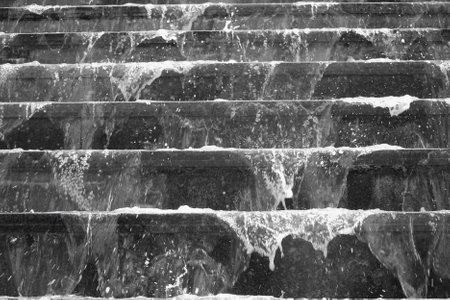 Running water over ancient stairs at Pairi Daiza (Belgium)の写真素材