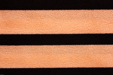 Black and pink striped cushions on a pure の写真素材