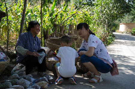With children in rural areas to buy natural pollution-free foodのeditorial素材