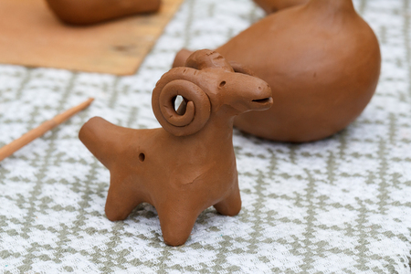 Belarusian traditional clay handmade. Clay made toy whistle figure sheep handmade craft.の写真素材