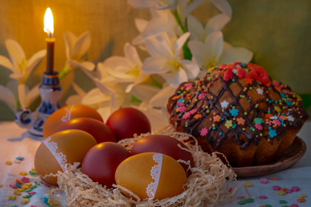 Easter cake, eggs and a candle