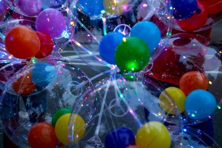 Colorful background of glowing balloons. Festival of LED decorations. The concept of energy-saving...