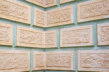 Fragment of the walls of the building in the style of Stalins classicism. Plastered beige and turquoise wall as background or texture for design.の写真素材