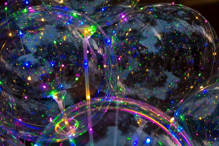 Colorful background of glowing balloons. Festival of LED decorations. The concept of energy-saving...