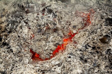 mesmerizing glow glowing orange fire for any design. The gray background or texture is represented...
