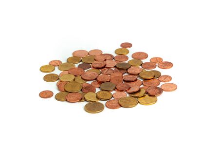scattering of colored coins of different denominations on a white background. Cash, coins of the...