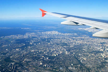 airplane is flying in the sky, the top view