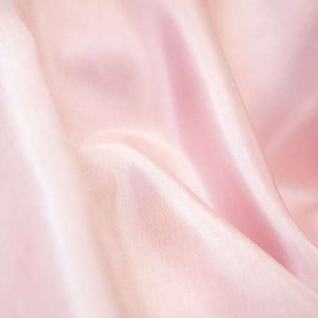 Light fabric texture, waving bedding sheets background, silk fabric backgroundの写真素材