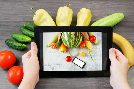 Organic Vegetables and fruits in wooden box, online market, green grocery delivery at home concept,...