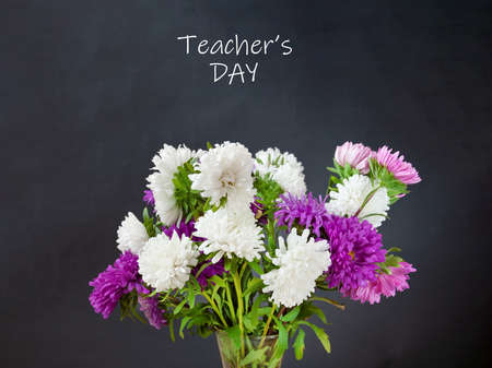 World Teacher's day concept. Flowers bunch, map, globe and books pileの写真素材