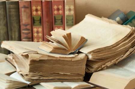 Book pile with apple, globe, pencils and sharpener on the school blackboard. Teacher's day concept