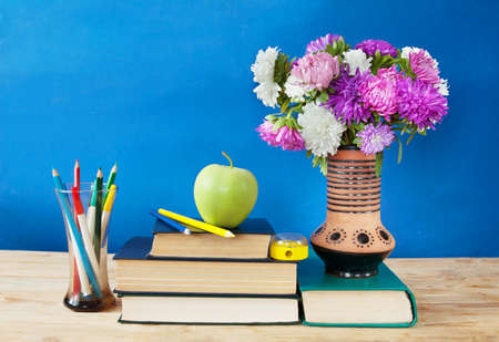 World Teacher's day concept. Flowers bunch, map, globe and books pileの写真素材