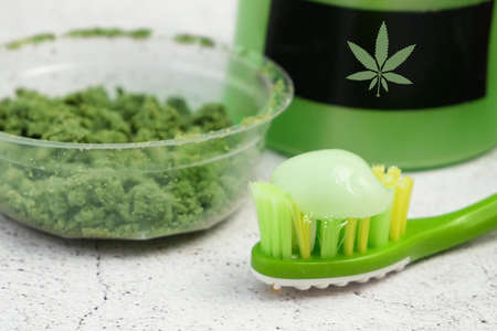 Cannabis cream cosmetic, toothpaste, soap with marijuana plant on background. Cannabis cosmetics