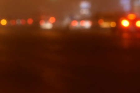 cars drive on the wet road at night, cars light disfocus of road, abstract background, blur, bokeh