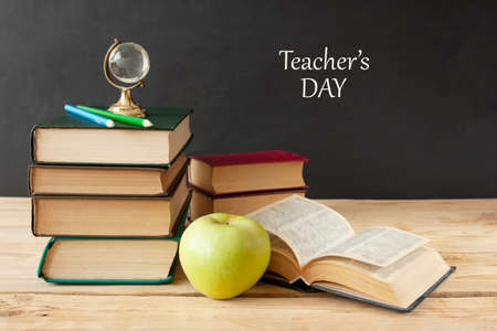 World Teacher's day concept. Flowers bunch, pencils globe and books