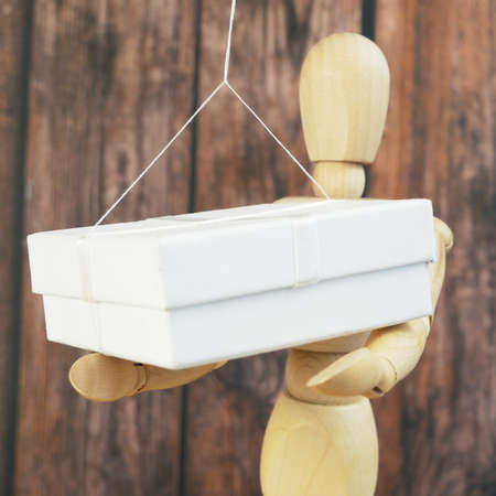 Contactless delivery concept. Scene model man and container with goods on a rope delivery, food bag...