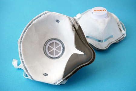 Many Respirators with high protection level. Protection against coronavirus. Respritors productuion, packing and delivery, closeupのeditorial素材