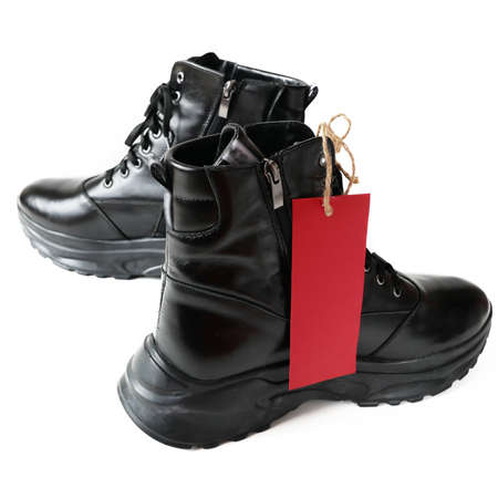 woman black boots for sale isolated on white