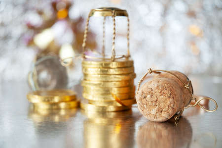 new year decorations on shining background with copy space with bow, ribbon and champagne cork,...