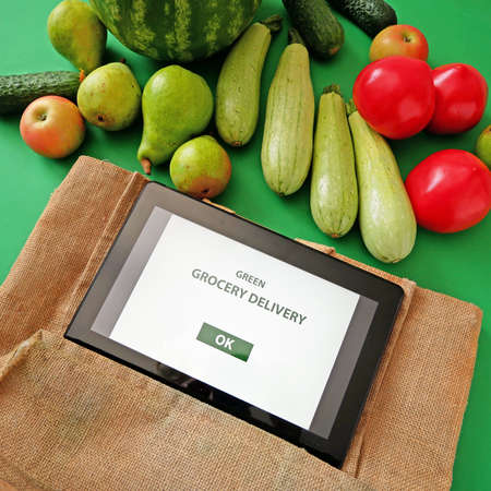 Organic Vegetables and fruits, tablet pc in wooden box, online market, green grocery delivery at...
