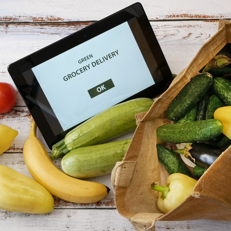 Organic Vegetables and fruits and taple pc, online market, green grocery delivery at home concept,...