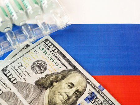 Russian flag, syringes, coronavirus vaccine and money, money for purchase and production vaccineの写真素材