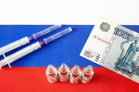 russian flag, vaccine  money, money for purchase and production vaccine, closeupの写真素材
