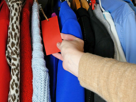 Modern woman clothing, large wardrobe with different clothes, home stuff, choice of clothes in the closet, closeupの写真素材