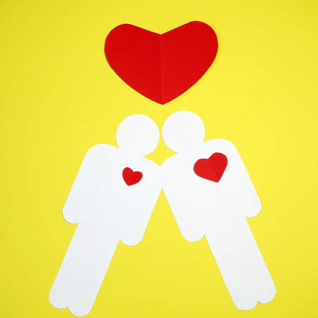 heart symbol between two people. love and relationship concept, valentine's day, closeup