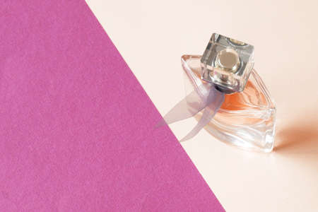 perfume on pink and lilac background, perfume with lilac fregranceの写真素材
