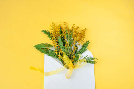 flowers as a gift in a craft envelope in greeting card, closeupの写真素材