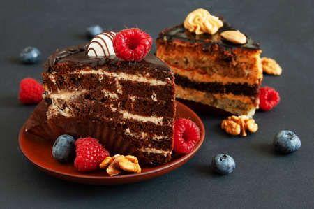 piece of cake with fresh raspberries and blueberries, closeupの写真素材