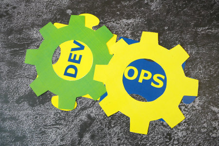 hands with magnifier glass with words Dev and Ops puzzles. Concept for software engineering culture and practice, closeupの写真素材