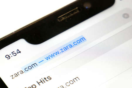 zara site with new modern collection in smartphone, closeup, macroのeditorial素材