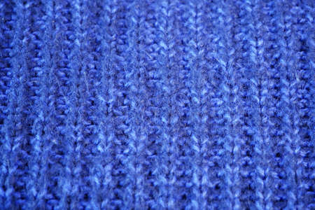 Details of knitted woolen fabric. textile background. Woolen Texture Background, Knitted Wool Fabric, Hairy Fluffy Textile. Closeupの写真素材