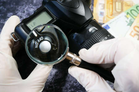 digital camera and money, store selling photographic equipment, pawnshop, closeupの写真素材