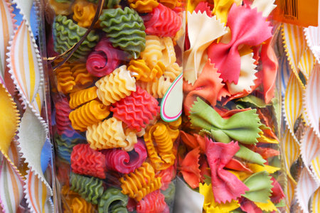 colorful Italian pasta background. Various colors of bow tie farfalle pasta. Top view. Closeupの写真素材