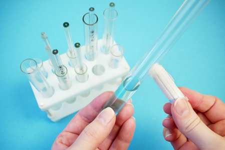 hands holds a menstrual swab in laboratory. effective protection of women during menstruation concept, closeupの写真素材