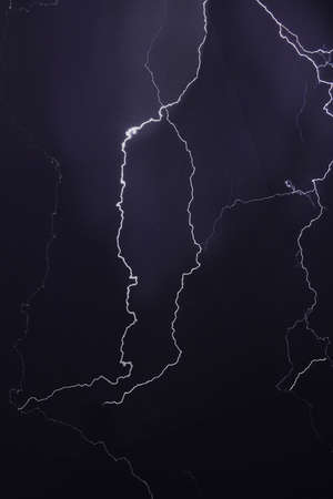 many lightning strikes on night sky background, outdoors