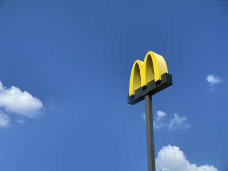 McDonald's logo sign. McDonald's is the world's largest chain of hamburger fast food restaurants, outdoorsのeditorial素材