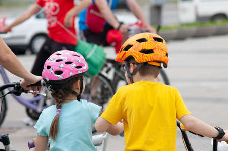 Boy and girl with bike in a helmet on competitions, closeupのeditorial素材