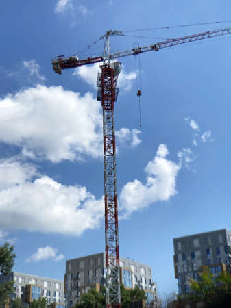 construction site and crane on the background blue sky, outdoors