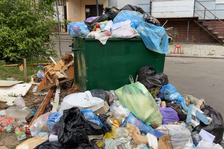Trash bin overloaded, no garbage collection problem, outdoors