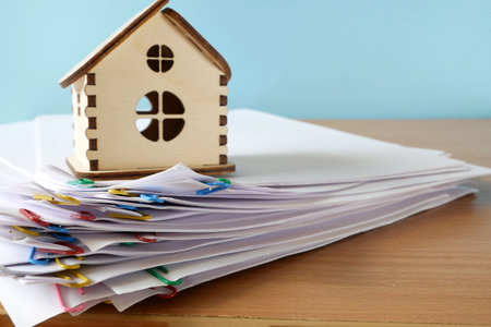 House model with real estate contract to buy house, insurance or loan and credit bank card real estate background, closeupの写真素材