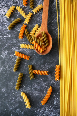 Various types of pasta, Raw pasta set and tomato, set, closeupの写真素材