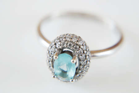 ring with blue topaz and white diamonds around, jewerly shop, pawnshop concept, closeupの写真素材