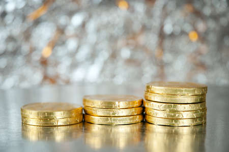 Cristmas greeting card with new year balls and coins, merry christmas and happy new year, closeup