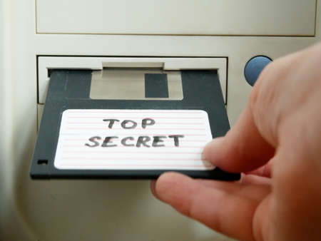Top secret information on retro vintage floppy disk magnetic computer, 3 1/2 disk, concept, closeupの写真素材