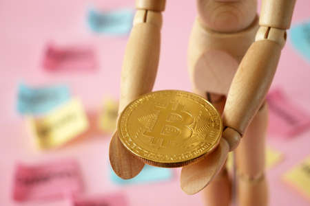 man model hold golden bitcoin and motherboard, block chain concept, closeup