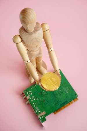 man model hold golden bitcoin and motherboard, block chain concept, closeupの写真素材